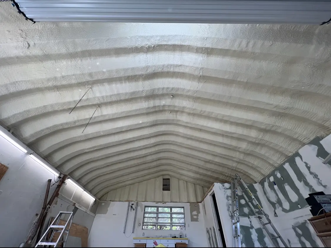 Spray polyurethane foam applied to the underside of a metal roof deck in Highlands Ranch